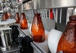 Machine de capsulage de bouteille de shampooing de cheveux de lotion de pompe conique de distributeur avec le système de galet