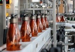 Machine de capsulage de bouteille de shampooing de cheveux de lotion de pompe conique de distributeur avec le système de galet