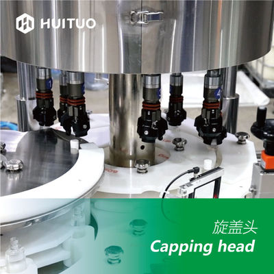 Machine de capsulage automatique Huituo 7200bph pour huile pour bébé à capuchon rond